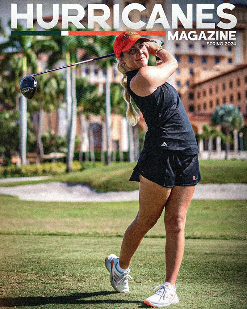Female golfer swinging golf club